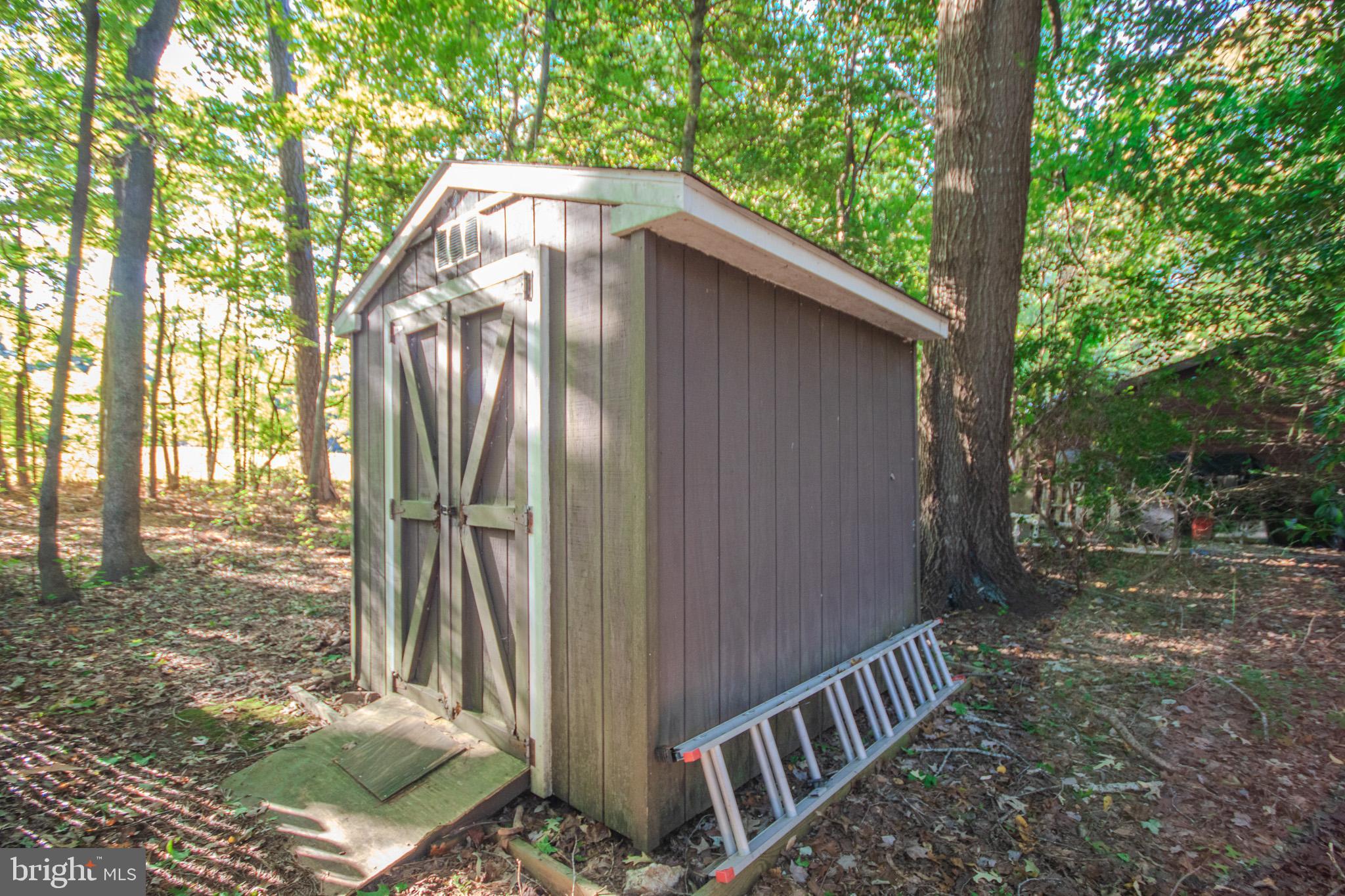 60 Beaconhill Road Ocean Pines, MD 21811 - Photo 28 of 30 a backyard of a house with outdoor seating