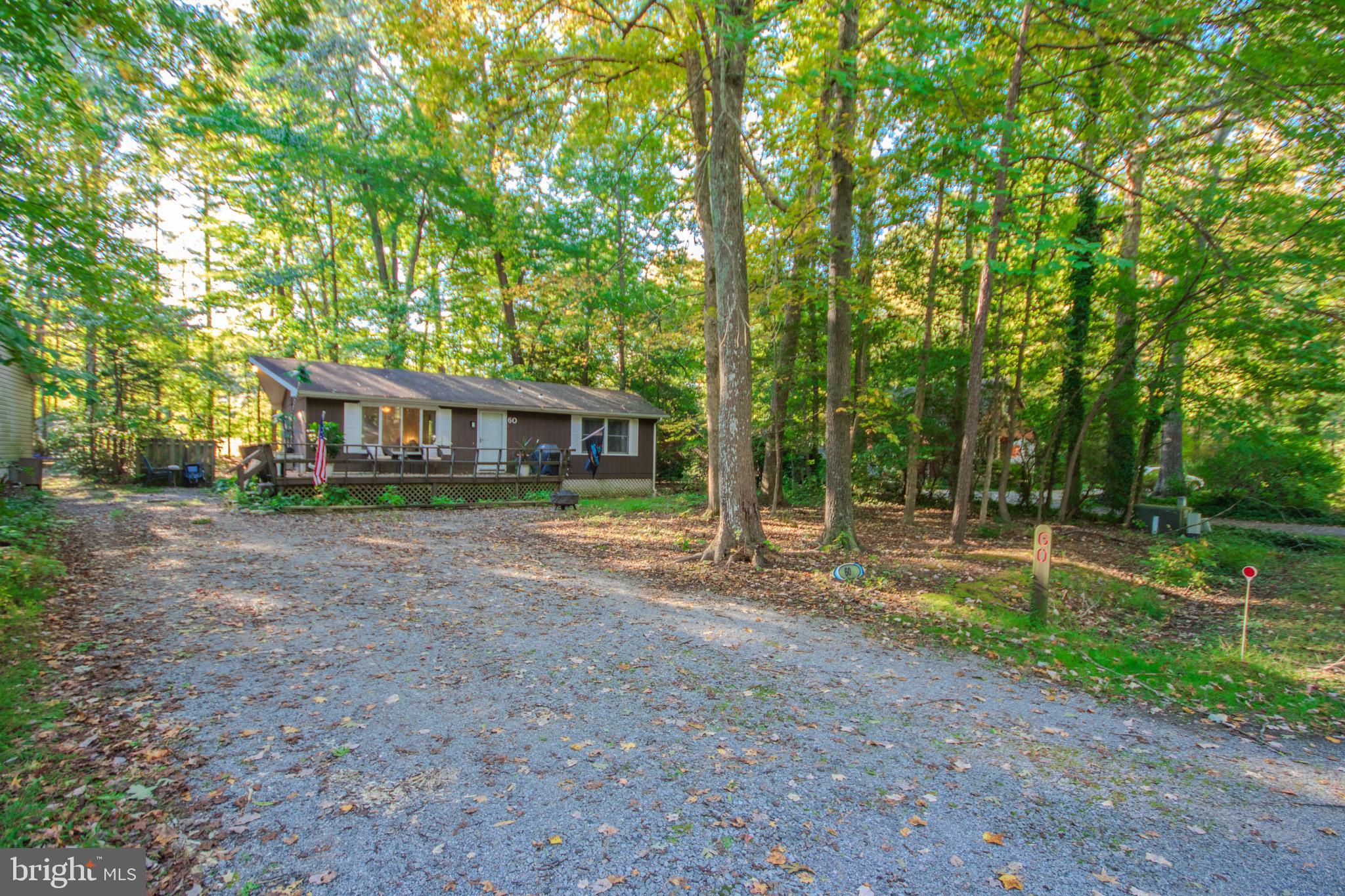 60 Beaconhill Road Ocean Pines, MD 21811 - Photo 3 of 30 a view of a house with backyard and trees