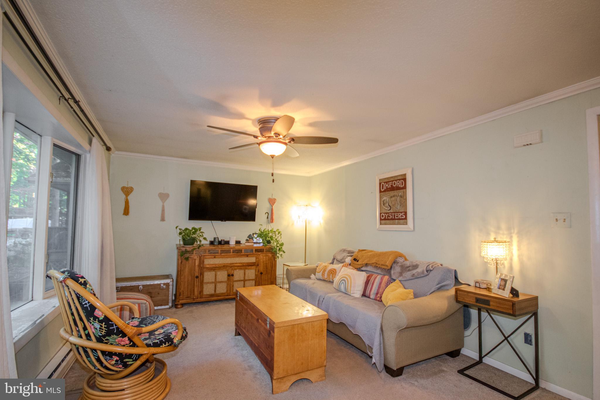 60 Beaconhill Road Ocean Pines, MD 21811 - Photo 5 of 30 a living room with furniture and a flat screen tv