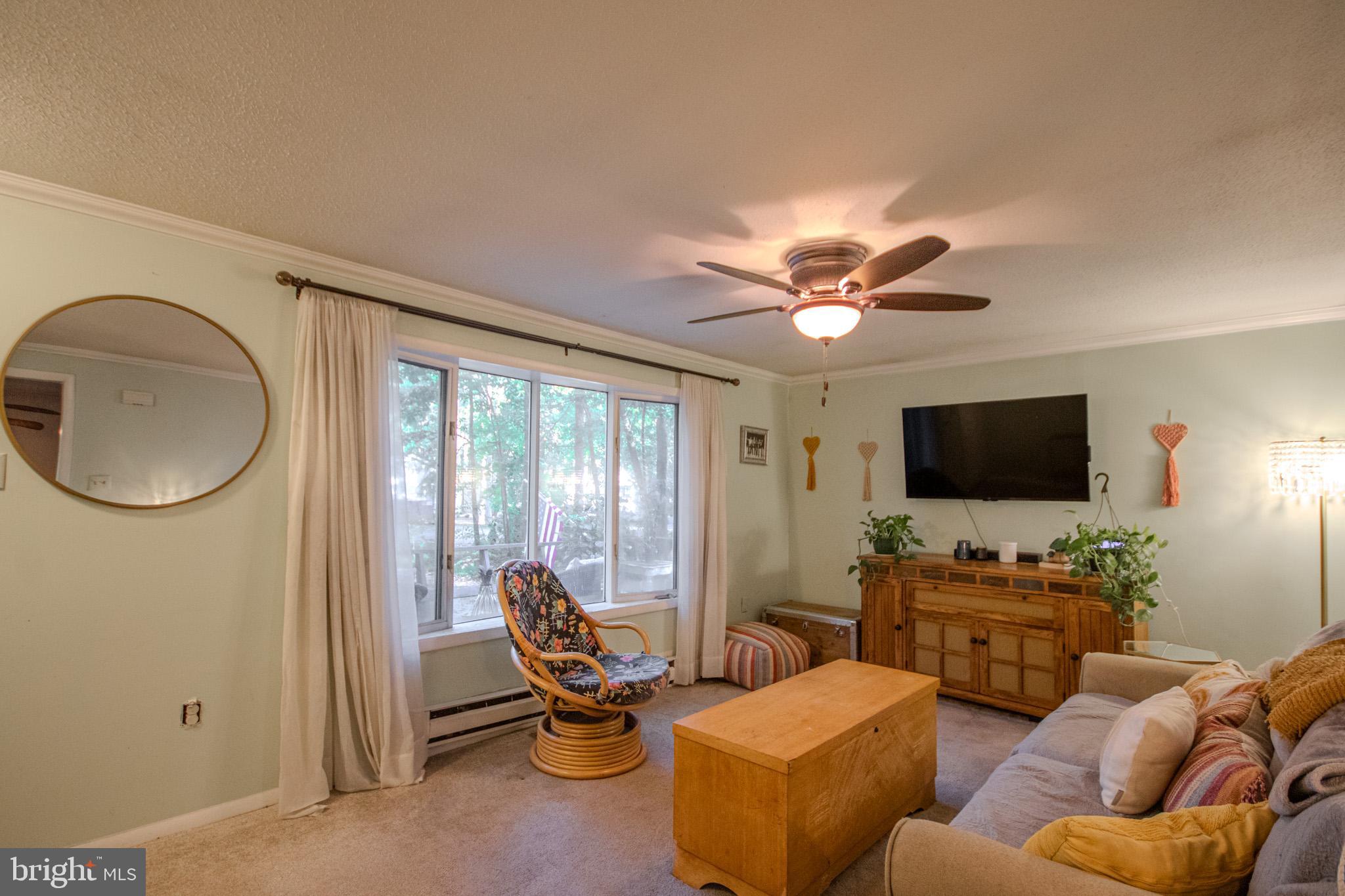 60 Beaconhill Road Ocean Pines, MD 21811 - Photo 6 of 30 a living room with furniture and a flat screen tv