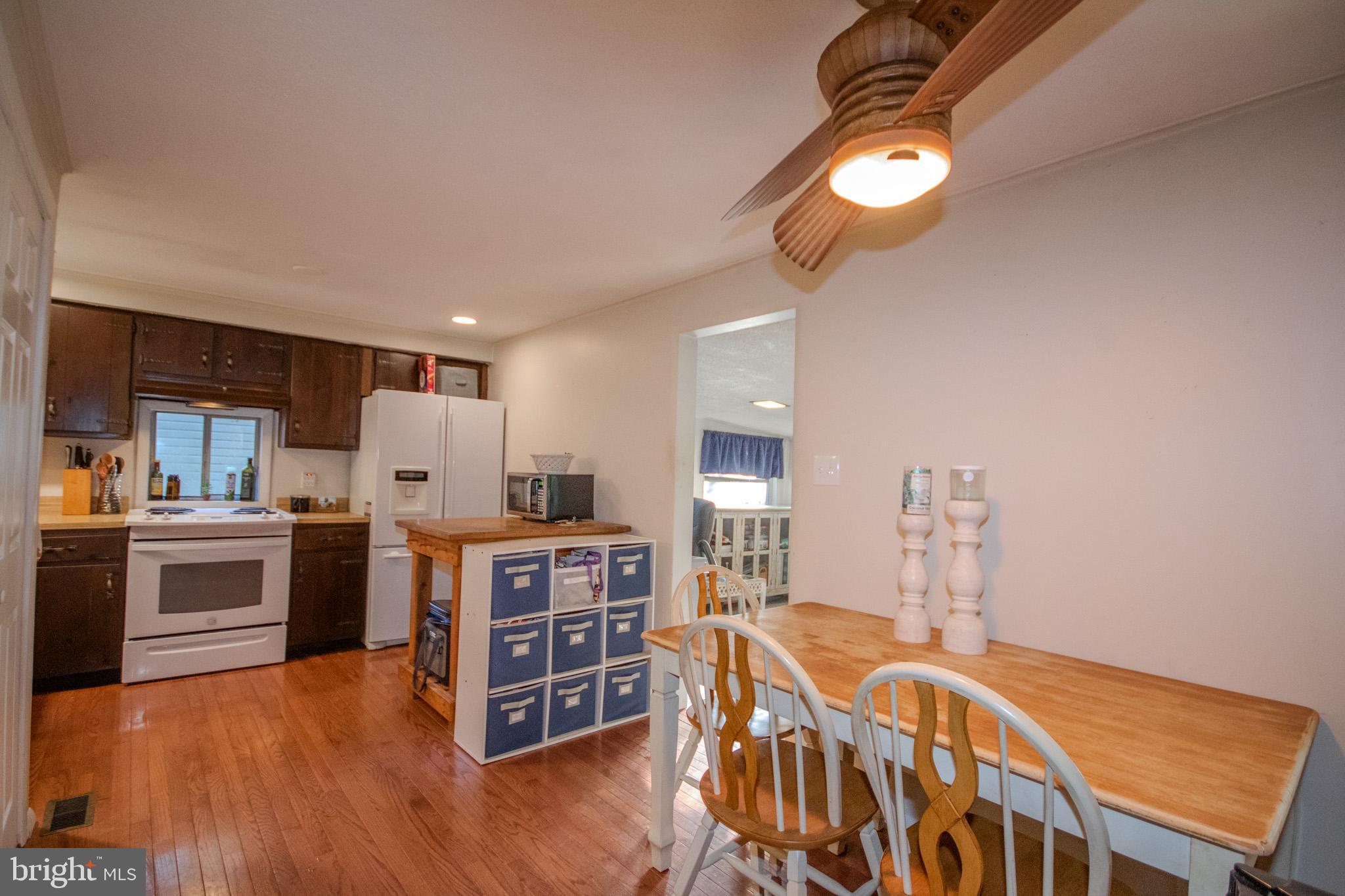60 Beaconhill Road Ocean Pines, MD 21811 - Photo 8 of 30 a living room with hard wood floors and a kitchen