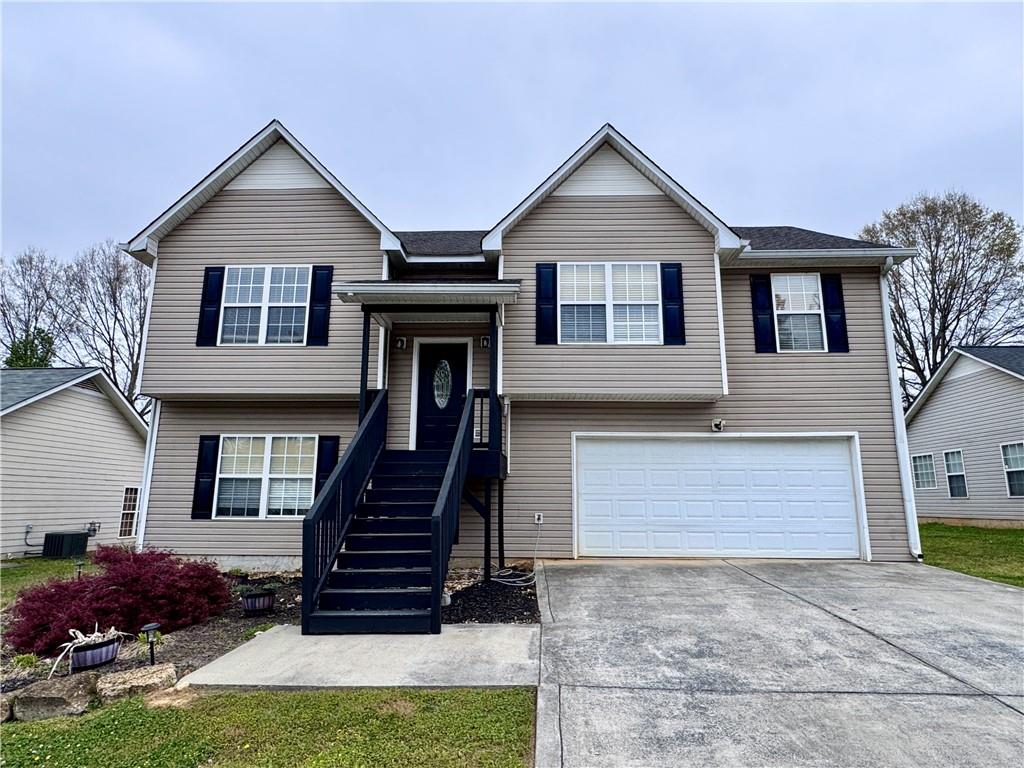 8 Honeytree Trail Northeast Rome, GA 30165 - Photo 1 of 1 a front view of a house with garden