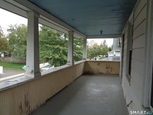 a view of a floor to ceiling window and a lake view