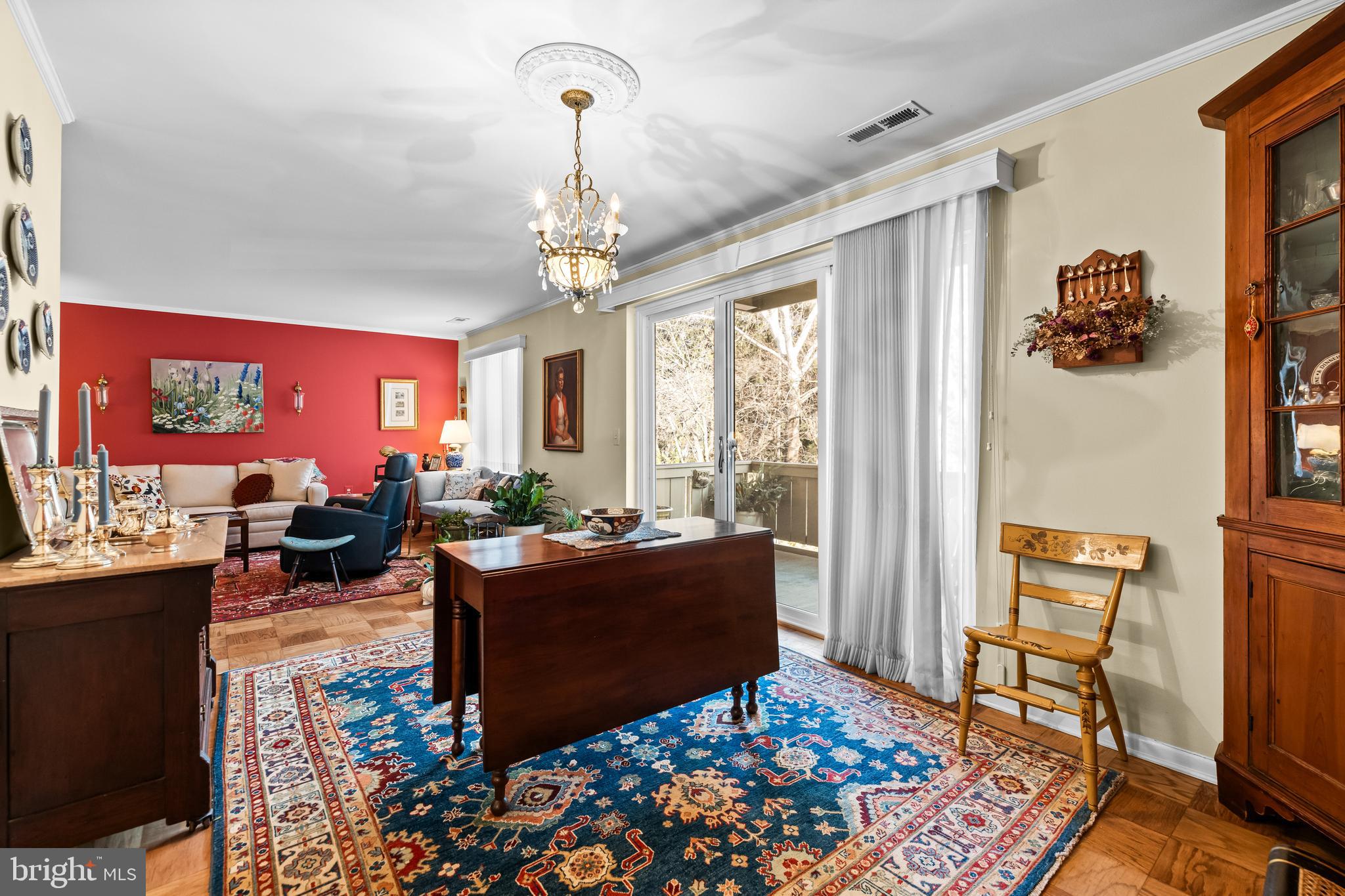 107 Cross Keys Road, Unit R107C Baltimore, MD 21210 - Photo 16 of 40 a living room with furniture and a chandelier