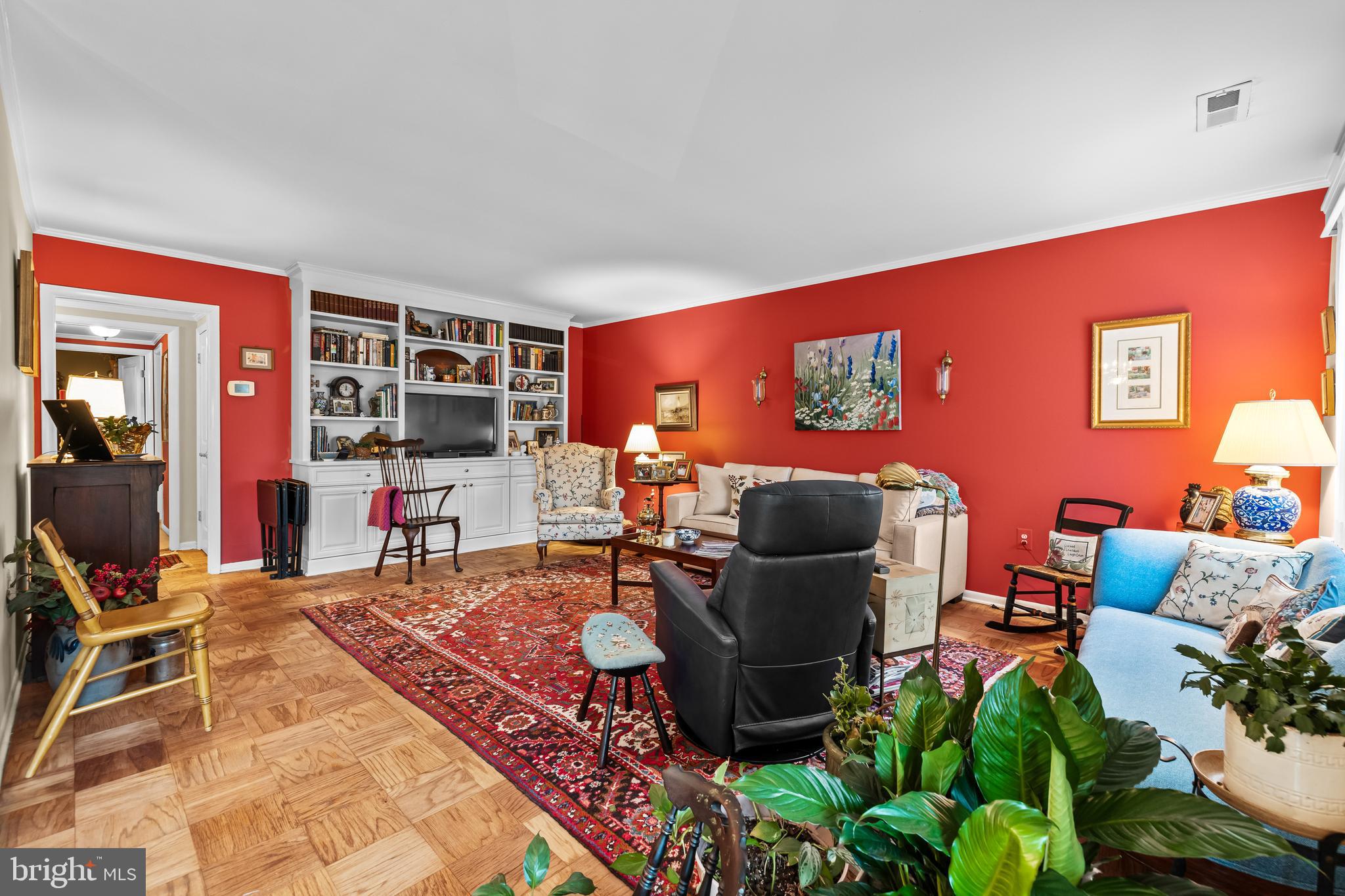 107 Cross Keys Road, Unit R107C Baltimore, MD 21210 - Photo 19 of 40 a living room with furniture a rug and a bookshelf