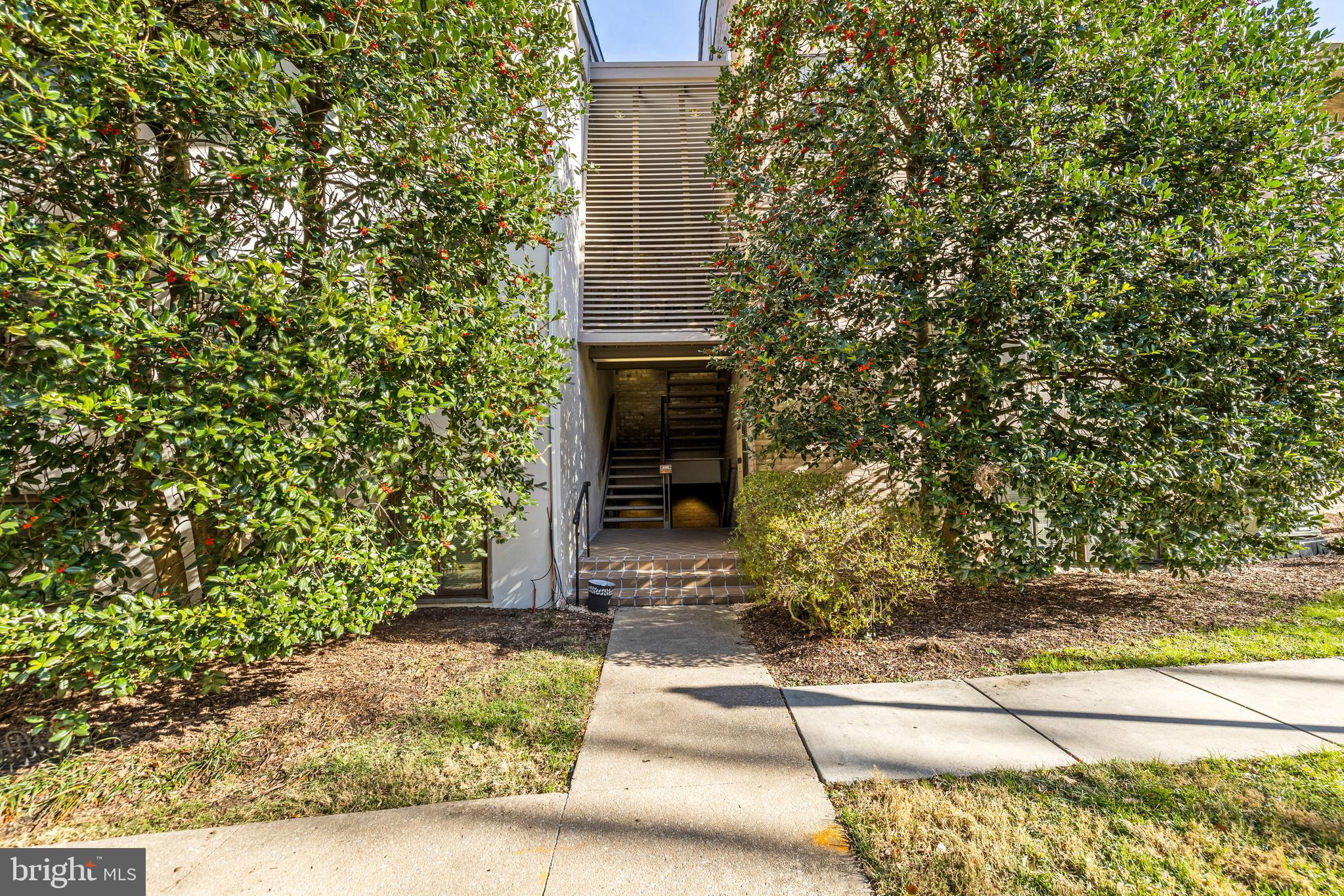 107 Cross Keys Road, Unit R107C Baltimore, MD 21210 - Photo 2 of 40 a front view of a house with a yard