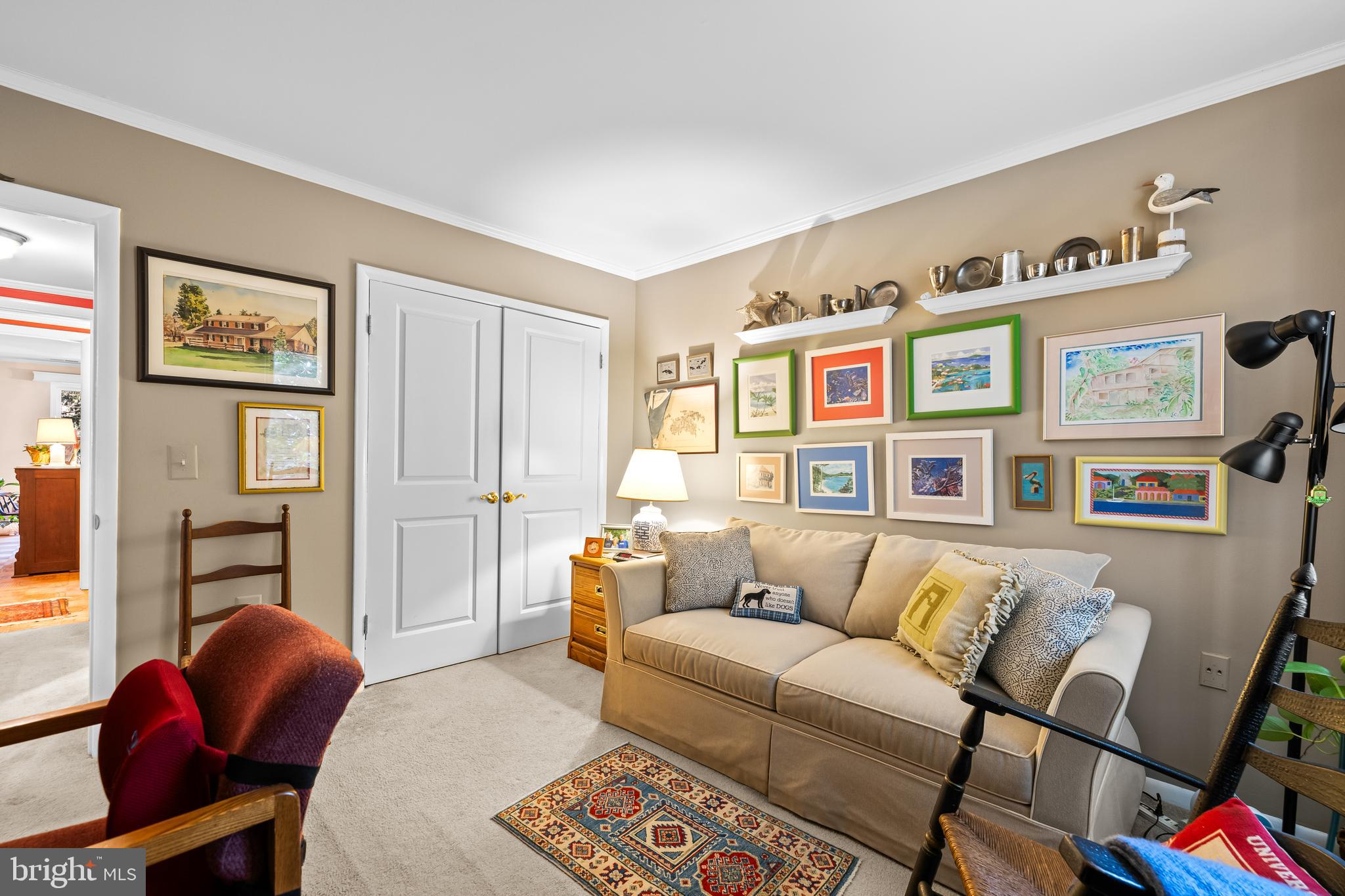 107 Cross Keys Road, Unit R107C Baltimore, MD 21210 - Photo 24 of 40 a living room with furniture and painting on the wall