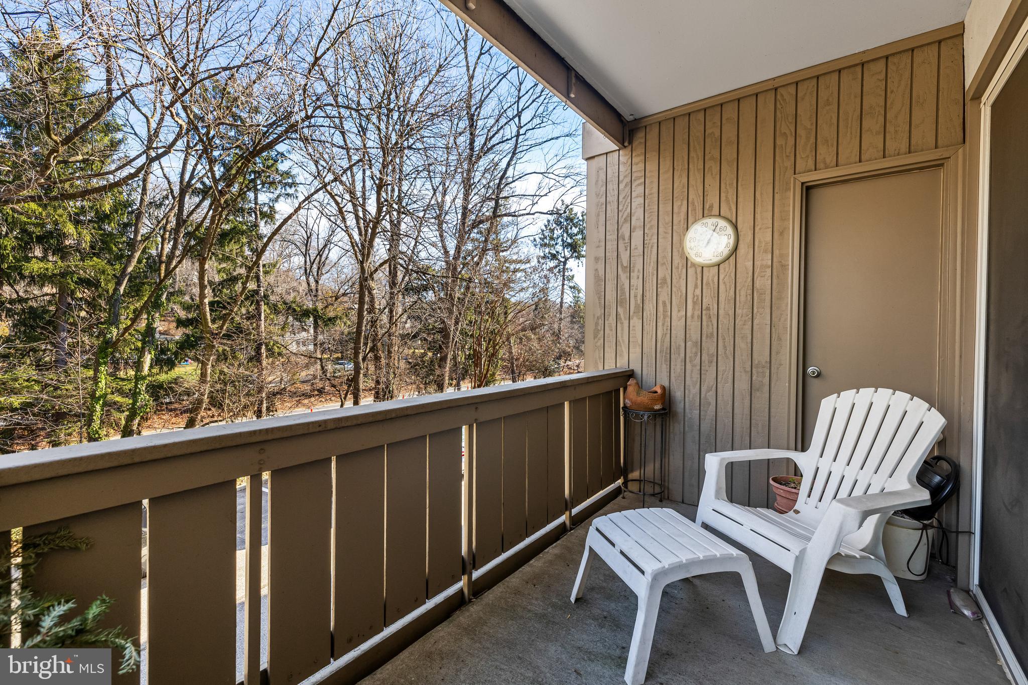 107 Cross Keys Road, Unit R107C Baltimore, MD 21210 - Photo 31 of 40 a view of a chair and table in the balcony