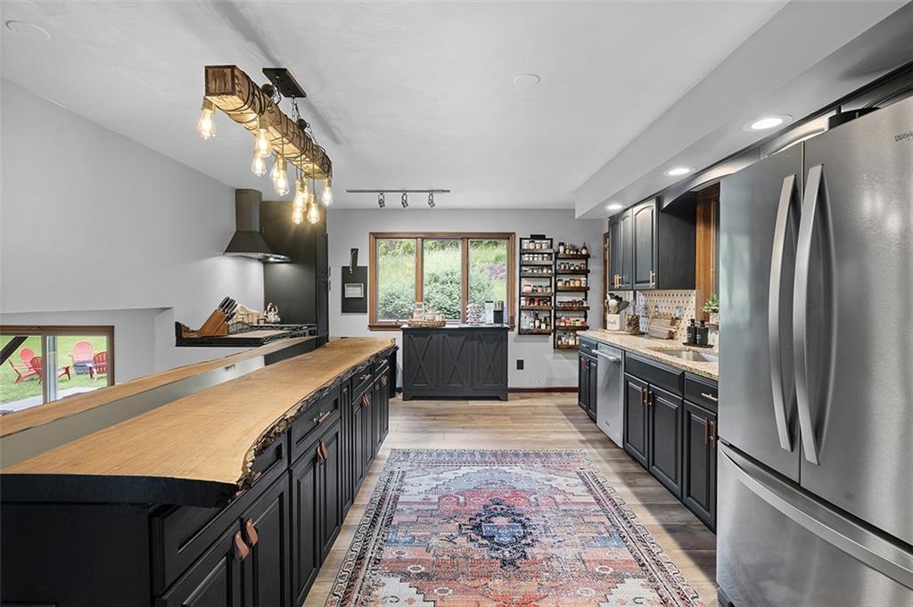 6178 Baker School Road Trafford, PA 15085 - Photo 11 of 48 a kitchen with stainless steel appliances granite countertop a refrigerator a stove and a sink