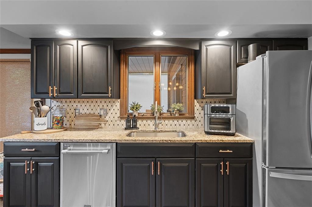 6178 Baker School Road Trafford, PA 15085 - Photo 14 of 48 a kitchen with refrigerator sink and cabinets