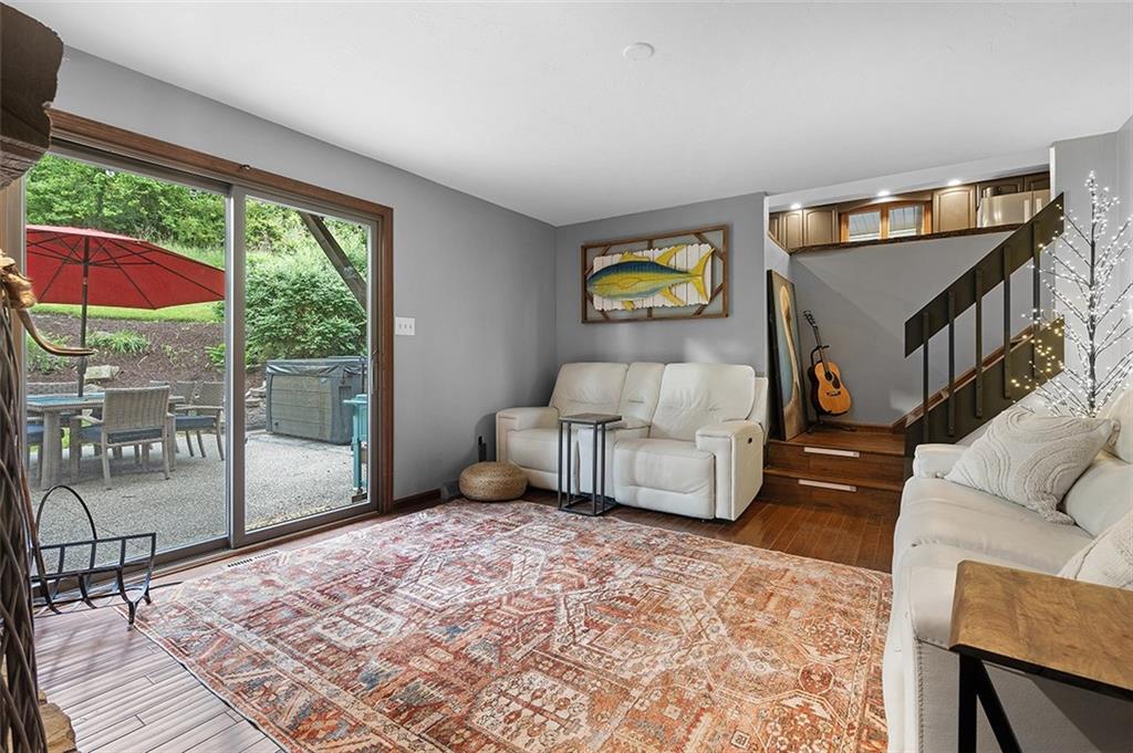 6178 Baker School Road Trafford, PA 15085 - Photo 18 of 48 a bedroom with furniture and a floor to ceiling window