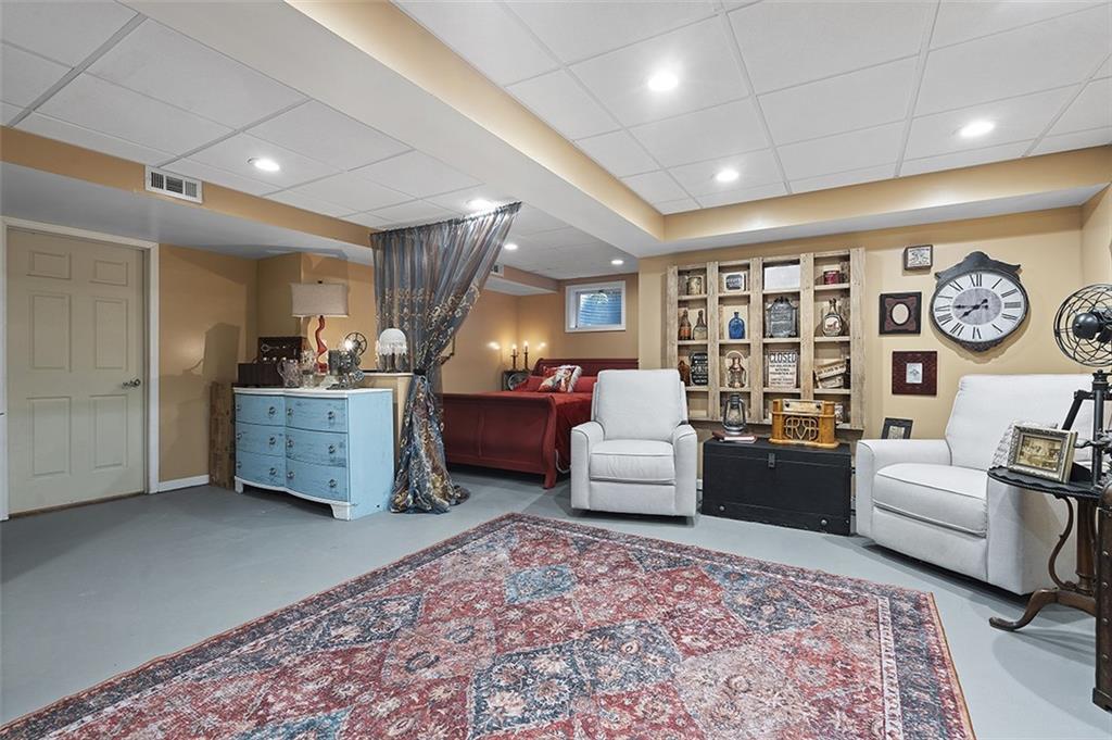 6178 Baker School Road Trafford, PA 15085 - Photo 23 of 48 a living room with furniture and a large window