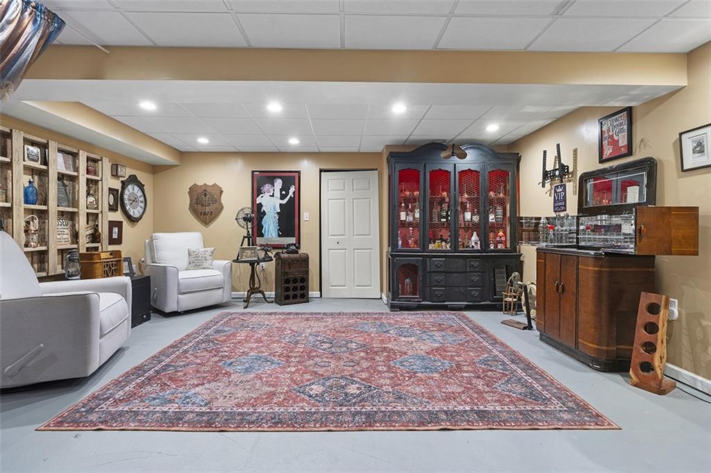 6178 Baker School Road Trafford, PA 15085 - Photo 26 of 48 a living room with furniture and a rug