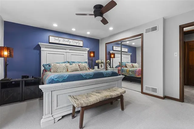 a bedroom with furniture and a chandelier