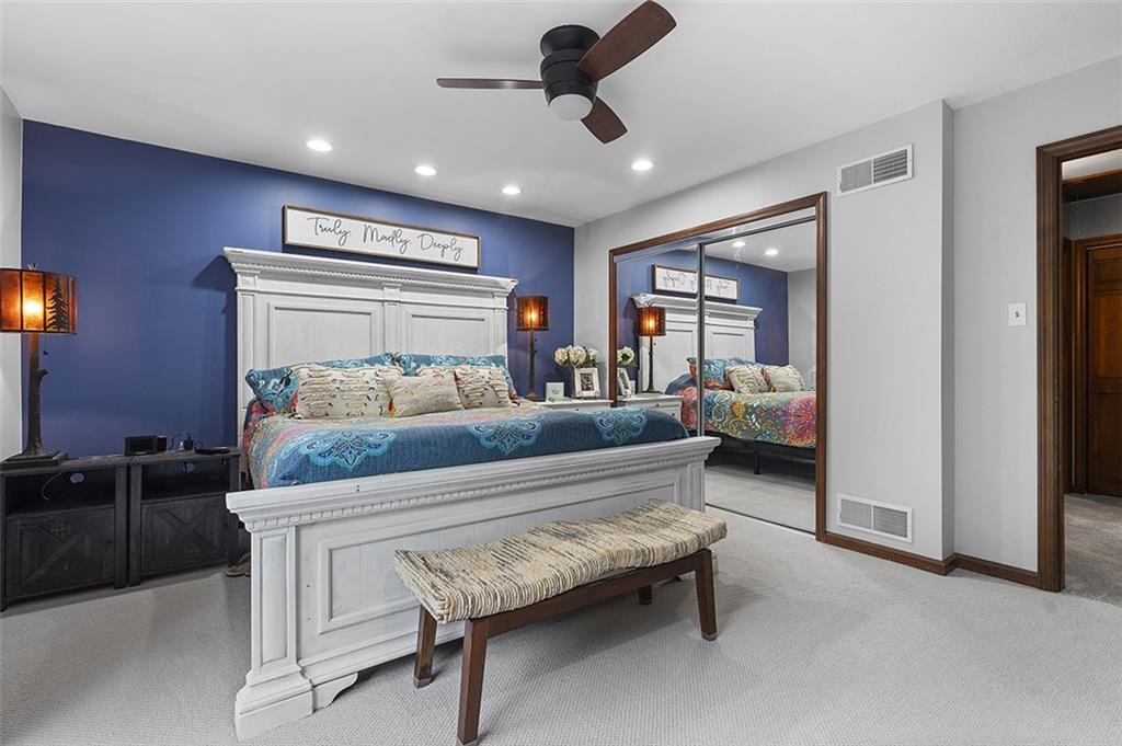 6178 Baker School Road Trafford, PA 15085 - Photo 30 of 48 a bedroom with furniture and a chandelier