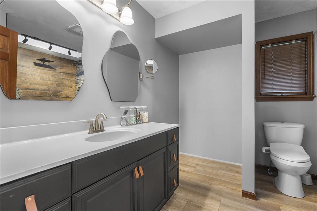 6178 Baker School Road Trafford, PA 15085 - Photo 32 of 48 a bathroom with a toilet sink and mirror
