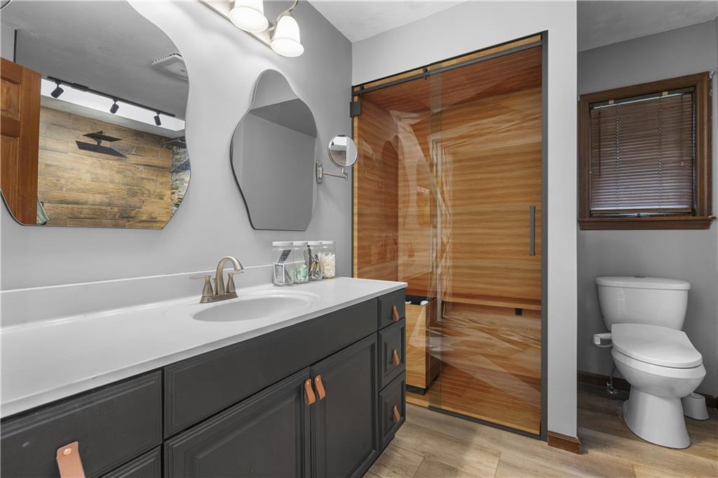 6178 Baker School Road Trafford, PA 15085 - Photo 33 of 48 a bathroom with a toilet sink vanity and mirror