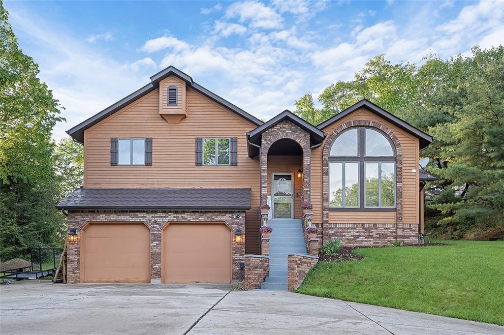 6178 Baker School Road Trafford, PA 15085 - Photo 47 of 48 a front view of a house with garden