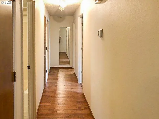 a view of a bathroom from a hallway