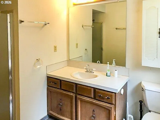 a bathroom with a sink and a window