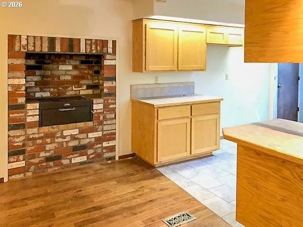 a kitchen with granite countertop a sink and a stove