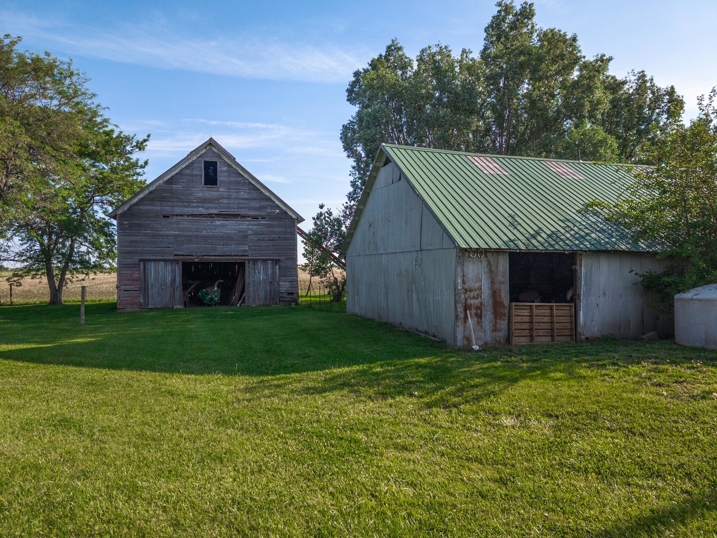 22037 East 2600 N Road Odell, IL 60460 - Photo 51 of 59 a front view of a house with a garden and trees