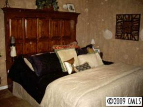 738 Forest Road Rock Hill, SC 29730 - Photo 4 of 8 a bedroom with bed and wooden floor
