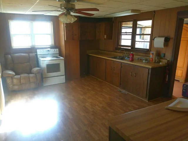 a kitchen with white cabinets and a sink