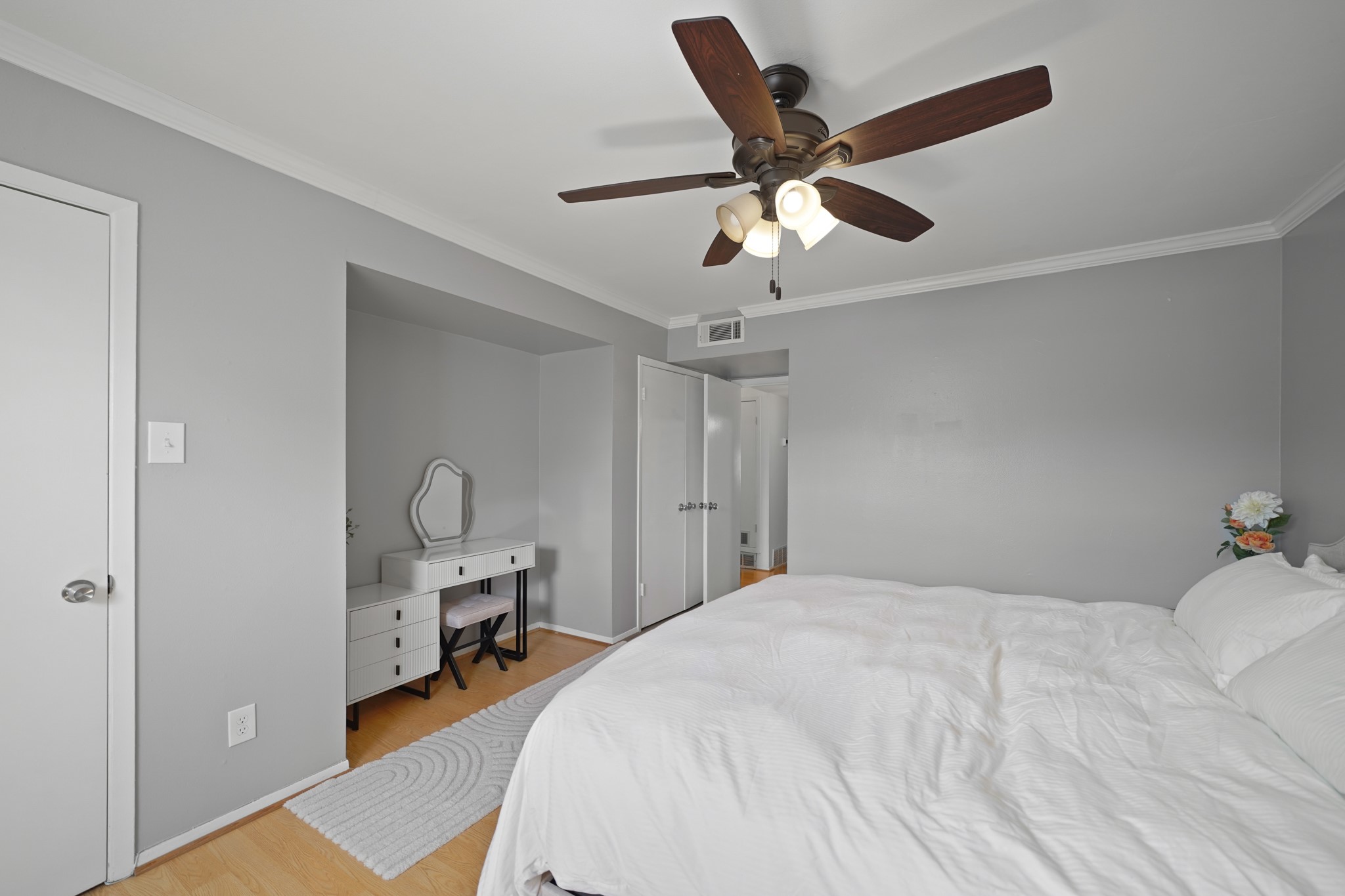 1235 Witte Road, Unit 8 Houston, TX 77055 - Photo 12 of 20 a bedroom with a bed and a chandelier