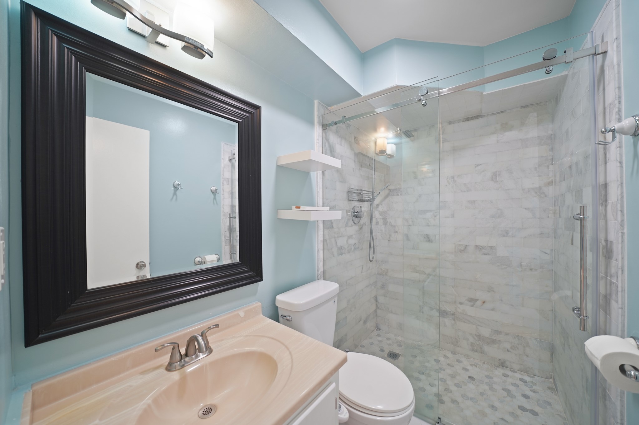 1235 Witte Road, Unit 8 Houston, TX 77055 - Photo 13 of 20 a bathroom with a sink a toilet and shower