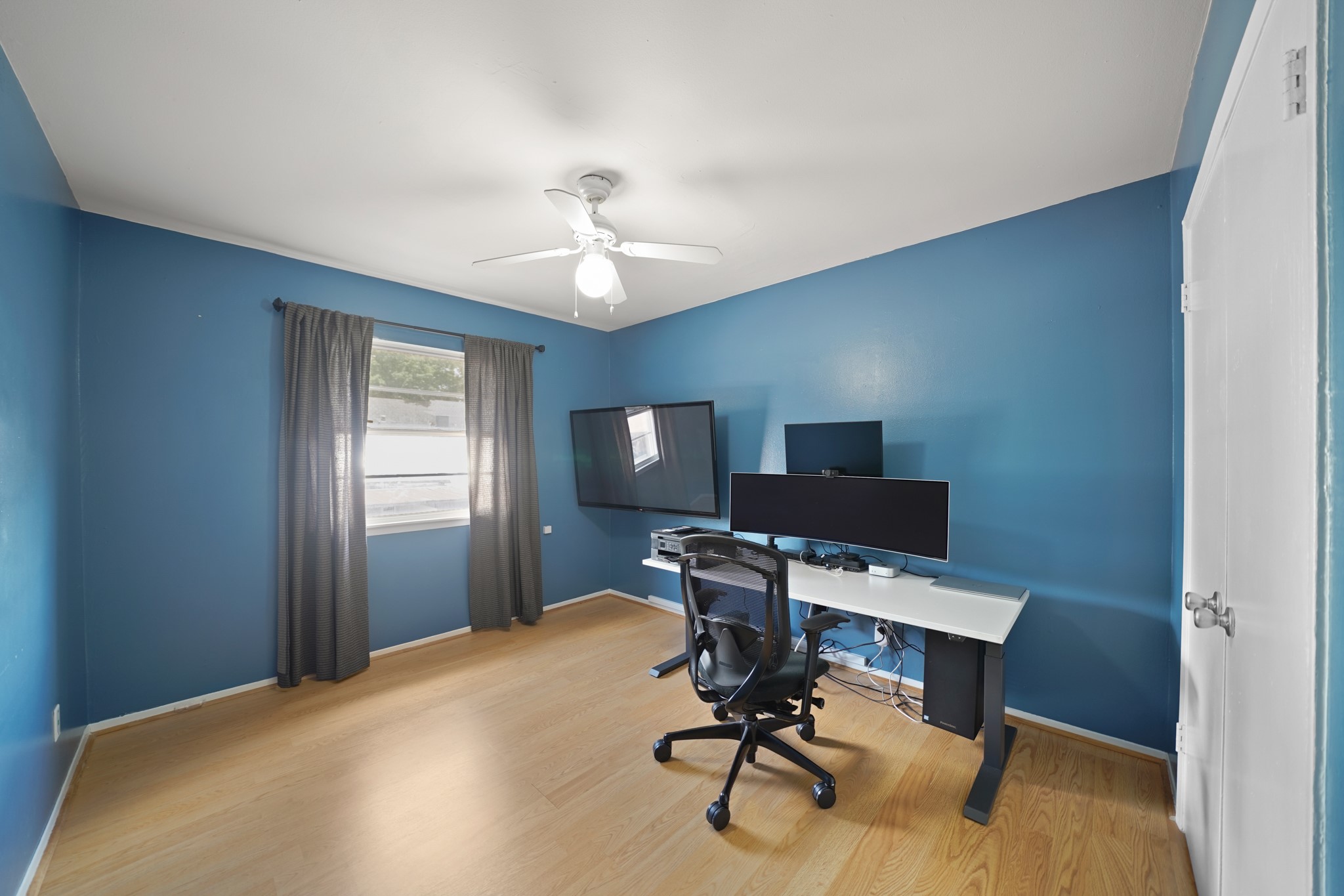 1235 Witte Road, Unit 8 Houston, TX 77055 - Photo 16 of 20 a view of a workspace with furniture and a window