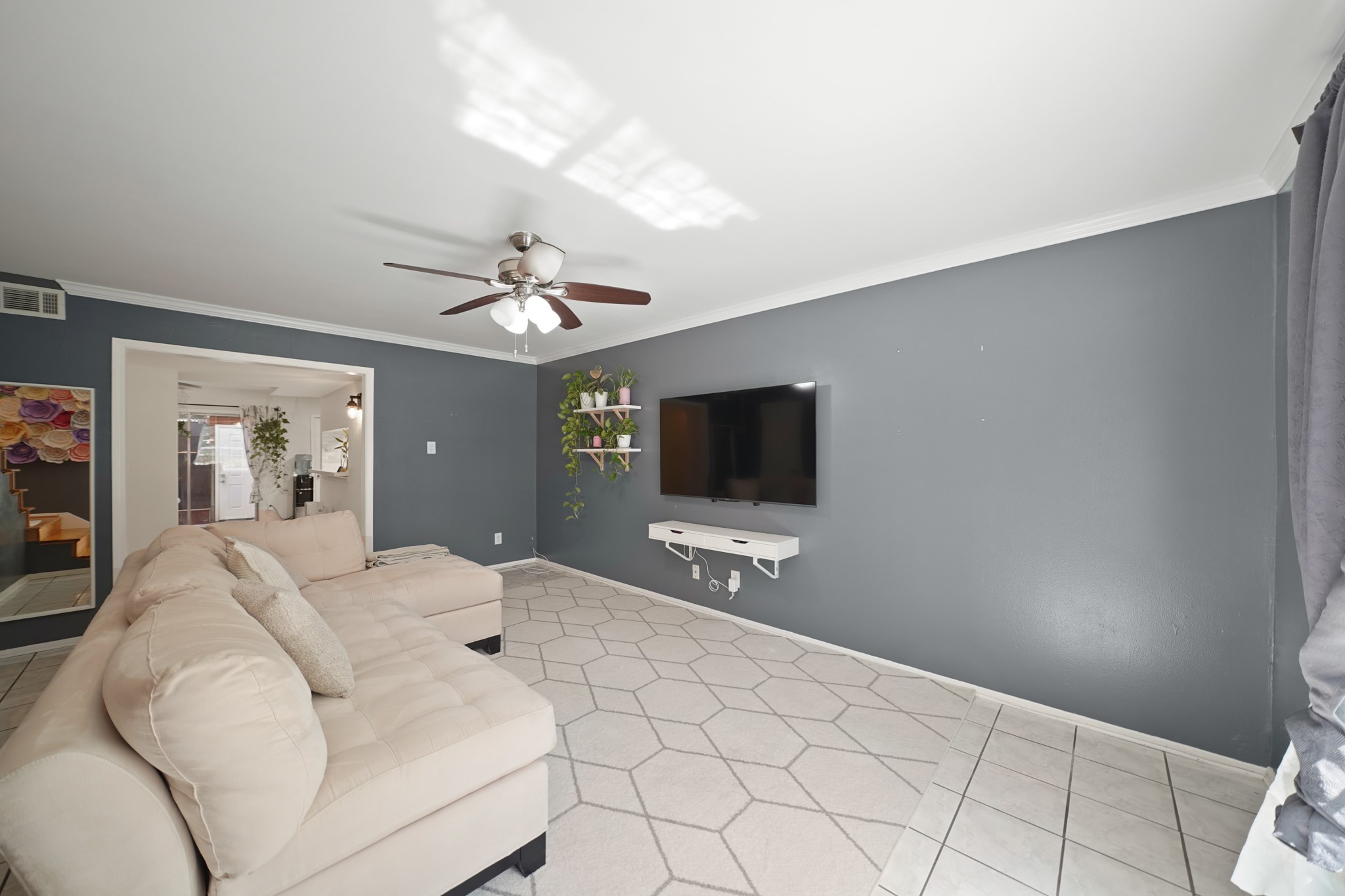 1235 Witte Road, Unit 8 Houston, TX 77055 - Photo 2 of 20 a bedroom with a bed and a flat screen tv