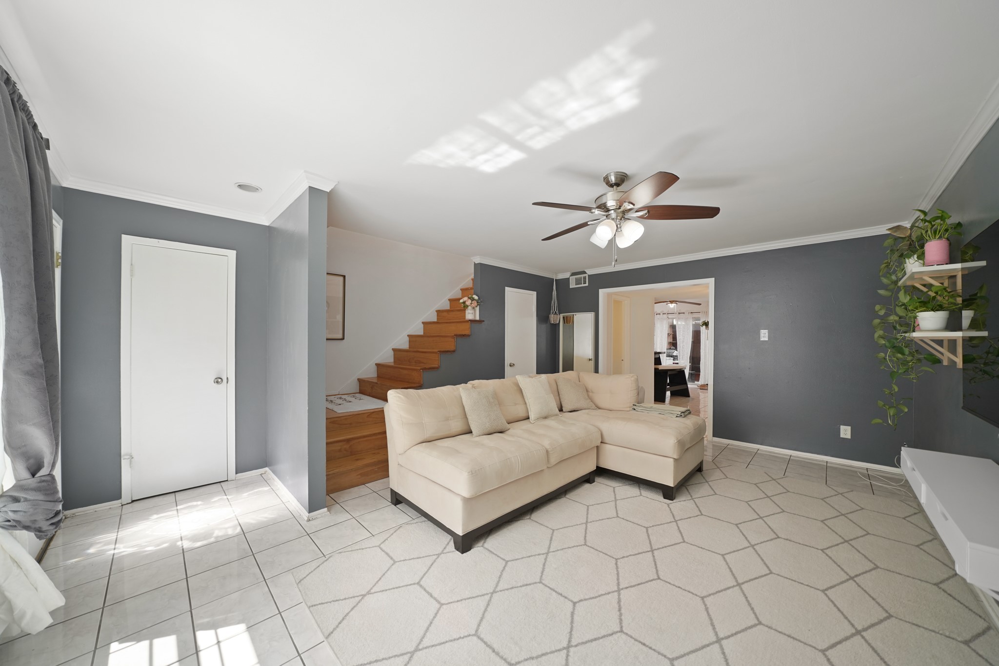 1235 Witte Road, Unit 8 Houston, TX 77055 - Photo 3 of 20 a living room with furniture and a chandelier