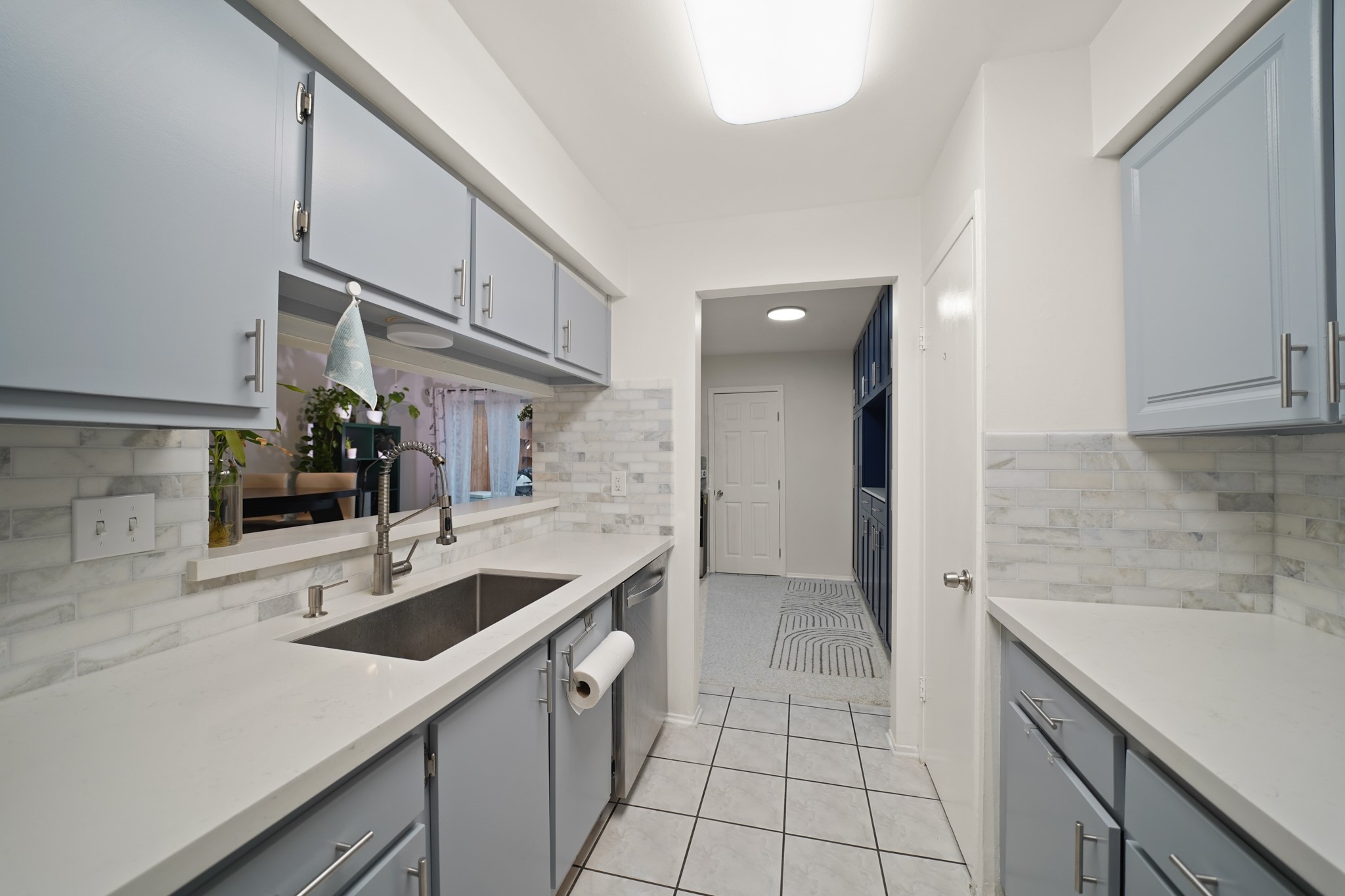 1235 Witte Road, Unit 8 Houston, TX 77055 - Photo 7 of 20 a kitchen with a sink cabinets and entryway