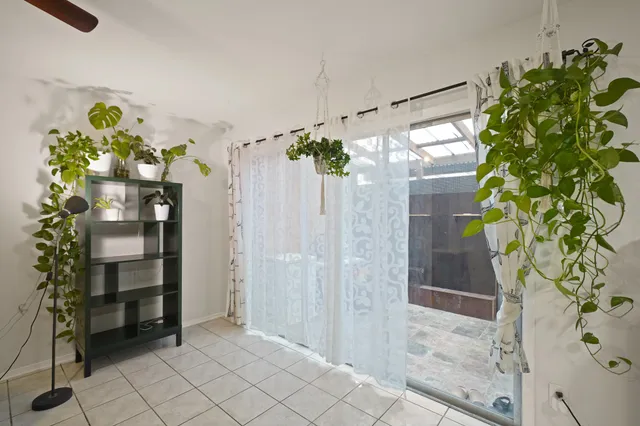 a view of bathroom with a potted plant