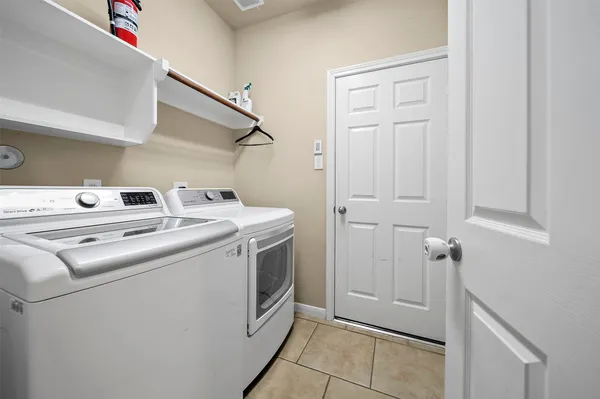 a utility room with dryer and washer
