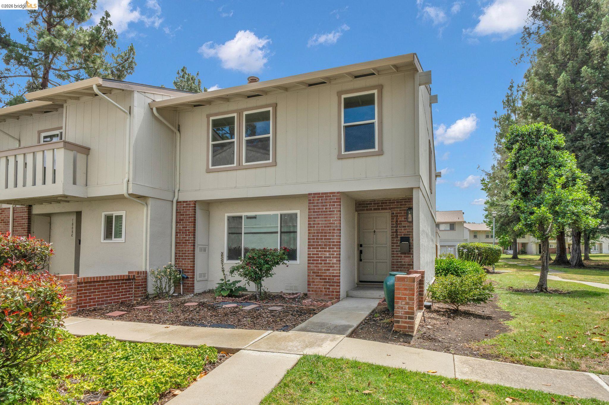 1808 Wildbrook Court, Unit D Concord, CA 94521 - Photo 2 of 47 a front view of a house with garden