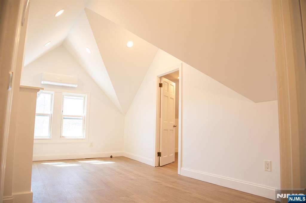 46 Garden Place, Unit 2 Edgewater, NJ 07020 - Photo 12 of 30 an empty room with windows and closet