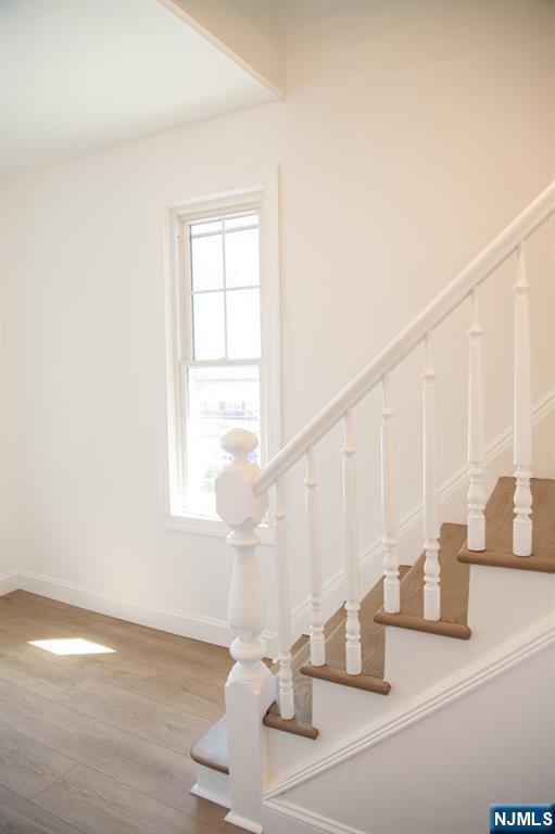 46 Garden Place, Unit 2 Edgewater, NJ 07020 - Photo 4 of 30 a view of staircase with open living room