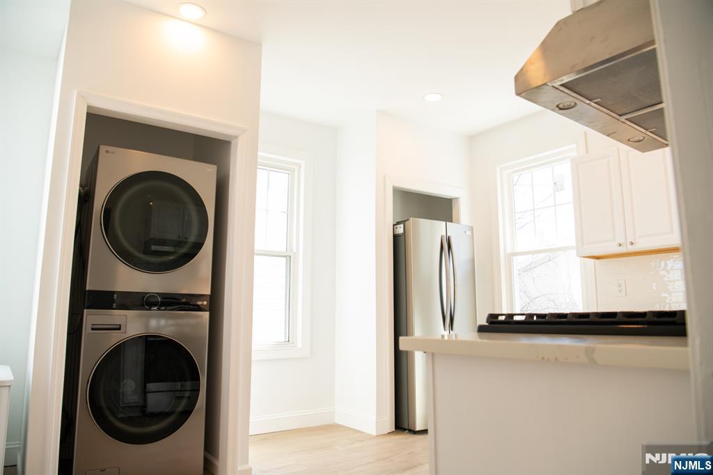 46 Garden Place, Unit 2 Edgewater, NJ 07020 - Photo 10 of 30 a view of a kitchen with washer and dryer