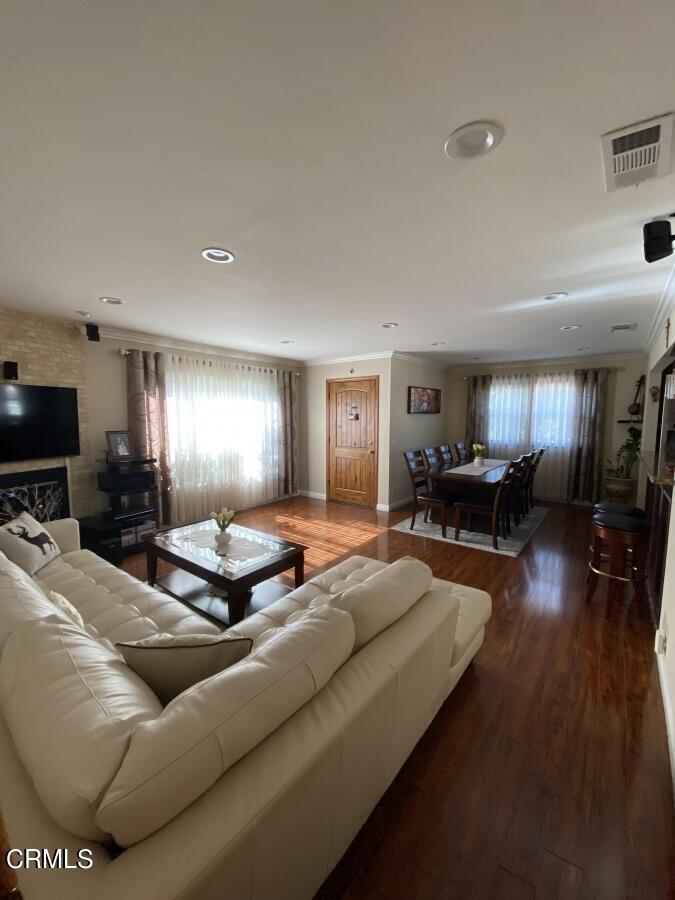 10444 Tujunga Canyon Boulevard Tujunga, CA 91042 - Photo 2 of 10 a living room with furniture and a flat screen tv