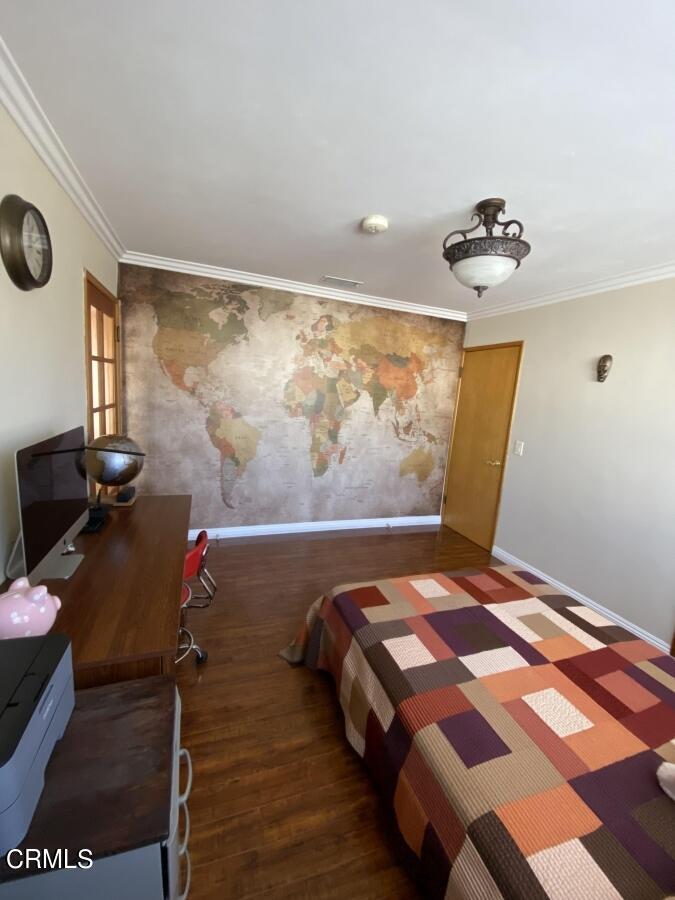 10444 Tujunga Canyon Boulevard Tujunga, CA 91042 - Photo 5 of 10 a bedroom with a bed and cabinets