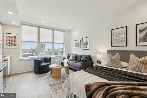 a living room with a couch and cabinets
