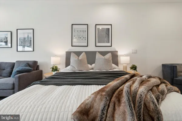 a bedroom with a bed and night stand