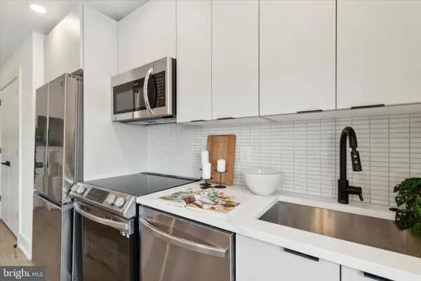 a kitchen with a sink and cabinets