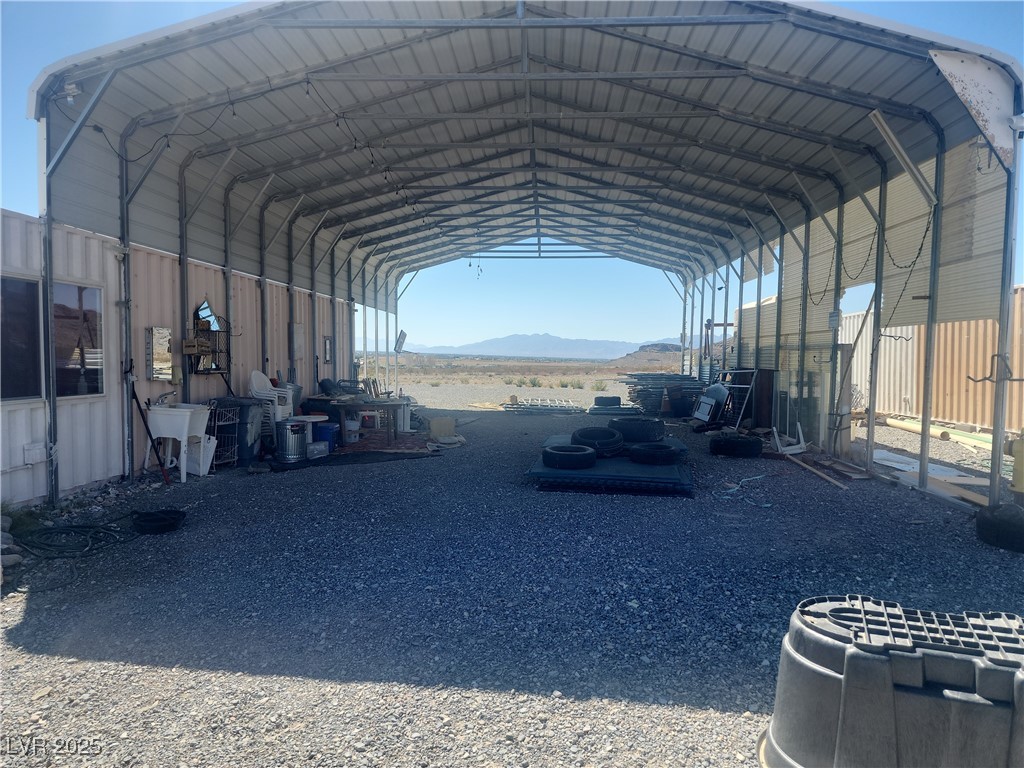 2311 West Mae Road Pahrump, NV 89060 - Photo 22 of 24 View of vehicle parking featuring a mountain view and a carport