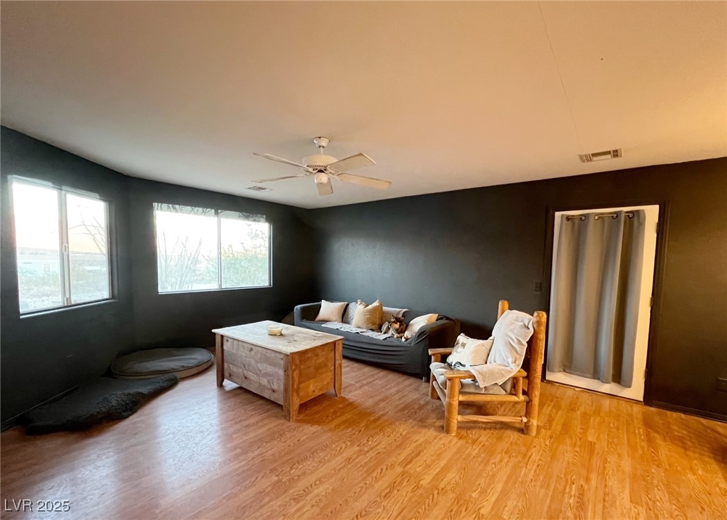 2311 West Mae Road Pahrump, NV 89060 - Photo 5 of 24 Living room featuring light wood-type flooring and a ceiling fan