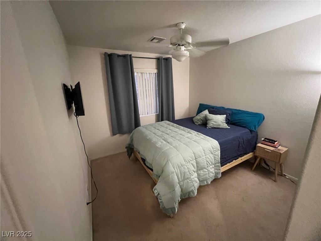 2311 West Mae Road Pahrump, NV 89060 - Photo 8 of 24 Bedroom with carpet floors and ceiling fan