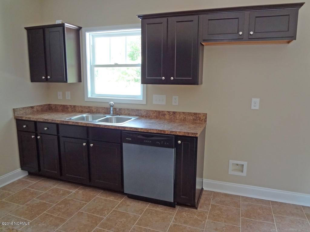 281 Folkstone Road Holly Ridge, NC 28445 - Photo 6 of 26 Kitchen Overlooking Back Yard