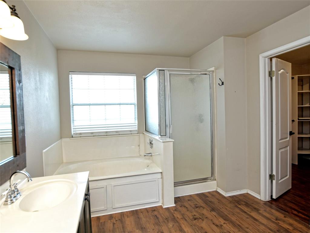 3031 Bent Tree Loop Round Rock, TX 78681 - Photo 18 of 28 The primary bathroom has a separate shower and garden tub